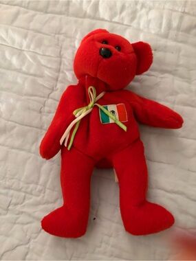 Red Plush Teddy Bear with Tricolor Patch and Ribbon
